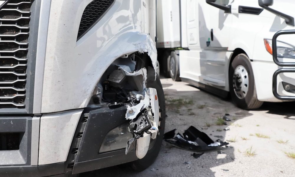 truck and car crash on road